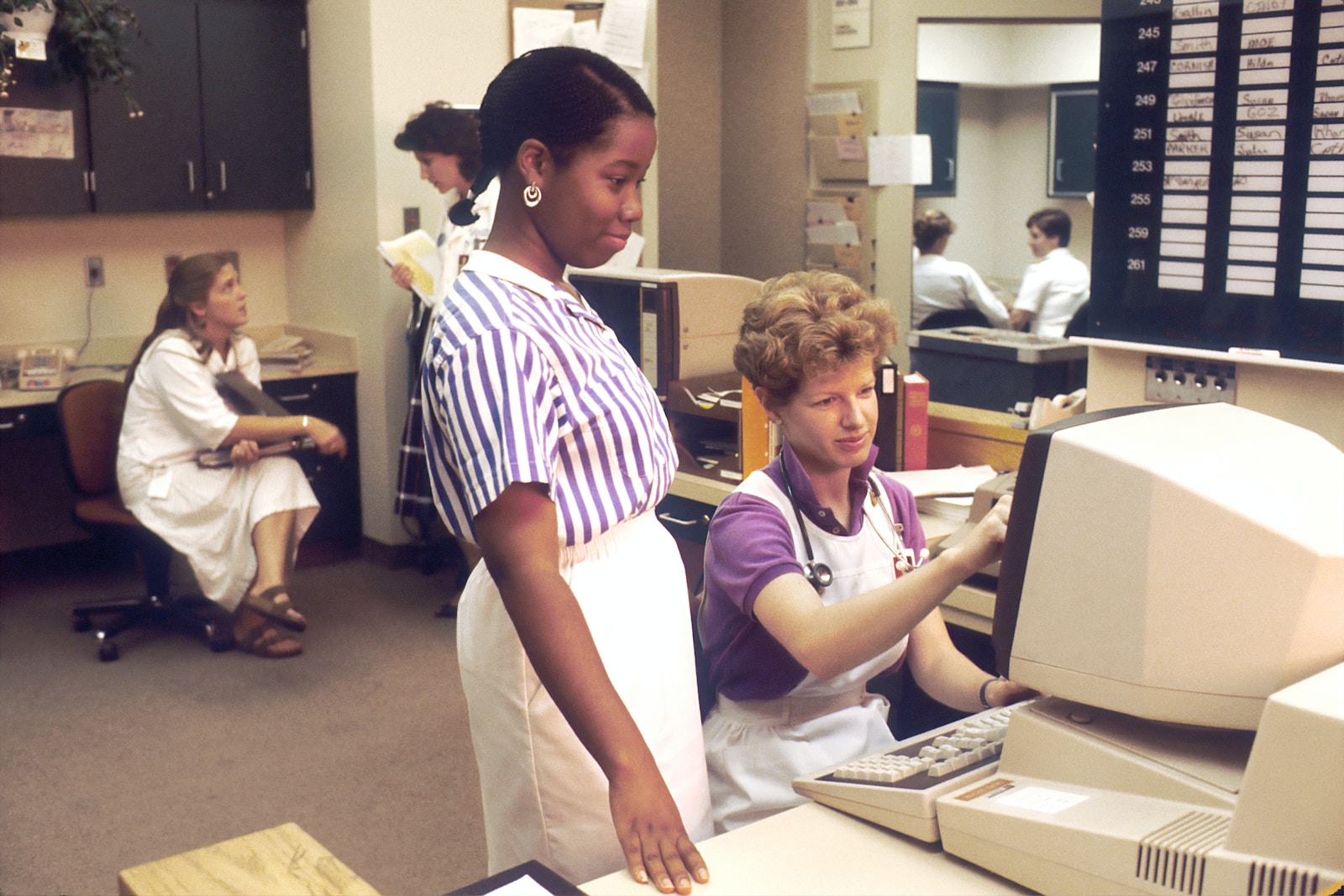 woman standing infront of computer